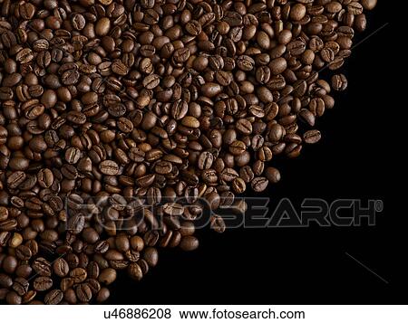 Stock Photo - Coffee beans against a black background.. Fotosearch