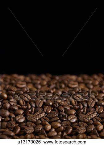 Coffee beans against a black background. View Large Photo Image Stock Photograph - Coffee beans against a black background.. Fotosearch