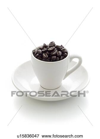 Stock Photo - Coffee cup filled with beans.. Fotosearch