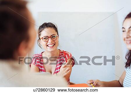 Colleagues enjoying discussion View Large Photo Image Stock Photo - Colleagues enjoying discussion. Fotosearch