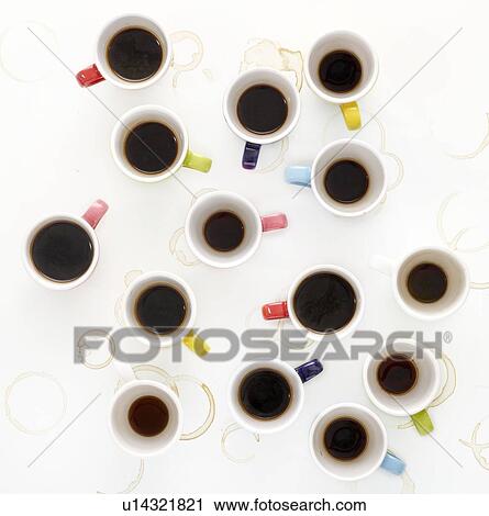 Stock Image - Colourful cups of coffee, high angle view.. Fotosearch