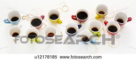 Stock Photography - Colourful cups of coffee, high angle view.. Fotosearch