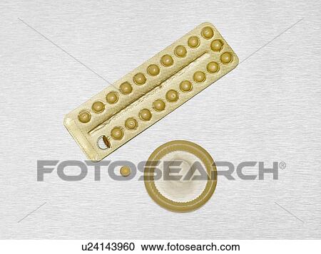 Contraception pills and condom against a white background. View Large Photo Image Stock Image - Contraception pills and condom against a white background.. Fotosearch