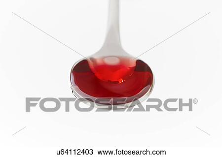 Stock Image - Cough syrup on a spoon.. Fotosearch