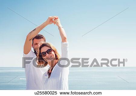 Couple by seaside View Large Photo Image Stock Photography - Couple by seaside. Fotosearch
