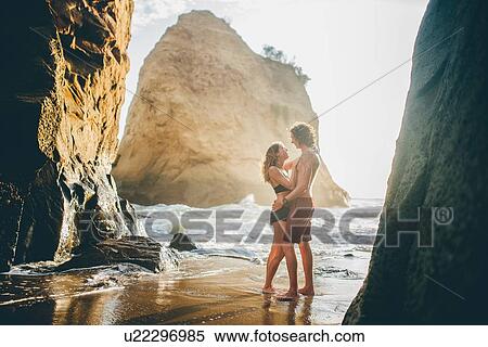 Stock Photography - Couple enjoying beach, Canoa, Manabi, Ecuador. Fotosearch