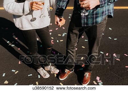 Couple having celebratory drinks View Large Photo Image Stock Image - Couple having celebratory drinks. Fotosearch