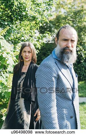 Couple in their garden View Large Photo Image Stock Photo - Couple in their garden. Fotosearch