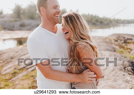 Couple laughing in Algonquin Park, Canada View Large Photo Image Stock Image - Couple laughing in Algonquin Park, Canada. Fotosearch