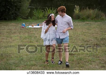 Couple leaving picnic in garden View Large Photo Image Stock Image - Couple leaving picnic in garden. Fotosearch
