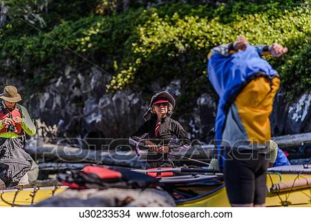 Picture - Couple on kayaking trip, Johnstone Strait, Telegraph Cove, Canada. Fotosearch
