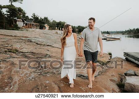 Stock Image - Couple walking in Algonquin Park, Canada. Fotosearch