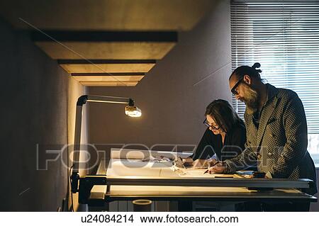 Couple working in home office View Large Photo Image Picture - Couple working in home office. Fotosearch