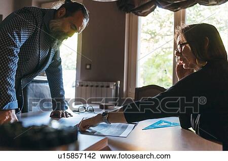 Couple working in home office View Large Photo Image Stock Image - Couple working in home office. Fotosearch
