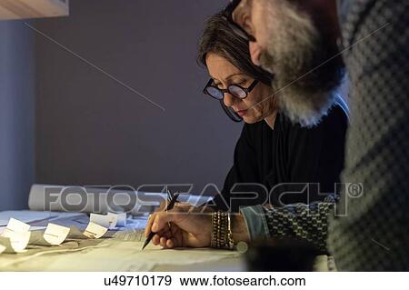 Stock Photo - Couple working in home office. Fotosearch
