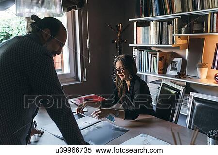 Couple working in home office View Large Photo Image Stock Photography - Couple working in home office. Fotosearch