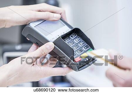 Customer paying by card. View Large Photo Image Stock Image - Customer paying by card.. Fotosearch
