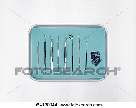 Picture - Dental equipment in a tray against a white background.. Fotosearch