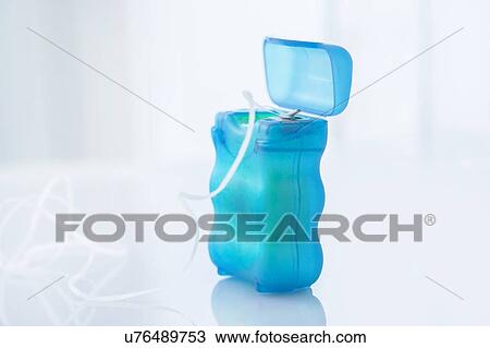 Stock Image - Dental floss against a white background.. Fotosearch