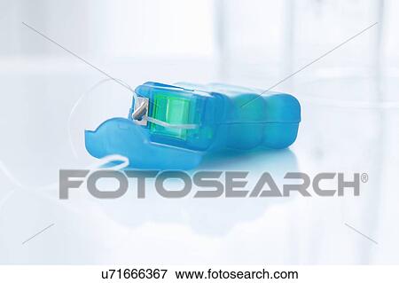Stock Photo - Dental floss against a white background.. Fotosearch