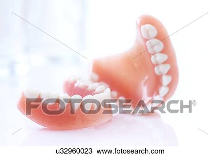 Dentures against a white background. View Large Photo Image Stock Image - Dentures against a white background.. Fotosearch