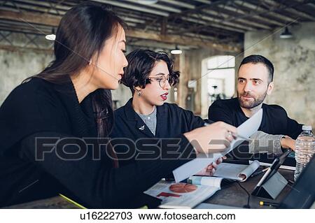 Stock Image - Designers at work in studio. Fotosearch