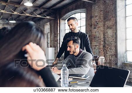 Designers at work in studio View Large Photo Image Stock Photo - Designers at work in studio. Fotosearch