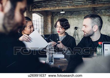 Stock Photo - Designers at work in studio. Fotosearch