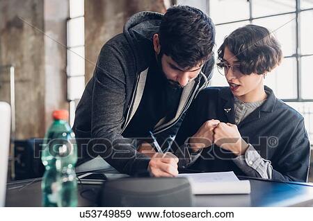 Stock Photo - Designers at work in studio. Fotosearch