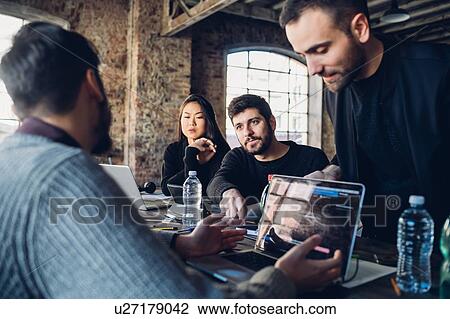 Designers brainstorming in studio View Large Photo Image Stock Image - Designers brainstorming in studio. Fotosearch