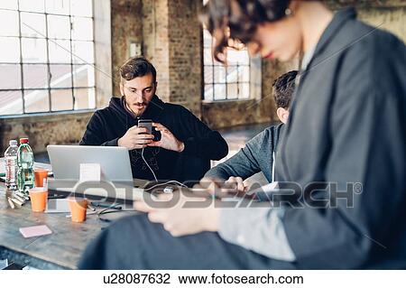 Designers brainstorming in studio View Large Photo Image Stock Image - Designers brainstorming in studio. Fotosearch