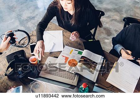 Designers having meeting in studio View Large Photo Image Stock Image - Designers having meeting in studio. Fotosearch