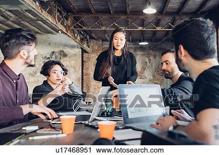 Designers having meeting in studio View Large Photo Image Stock Image - Designers having meeting in studio. Fotosearch