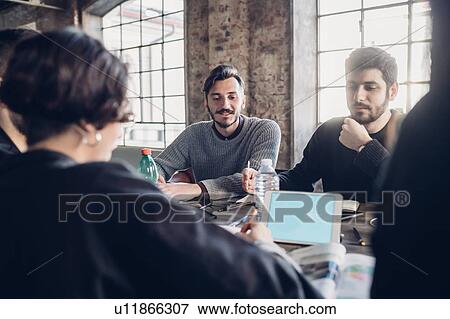 Designers having meeting in studio View Large Photo Image Stock Photo - Designers having meeting in studio. Fotosearch