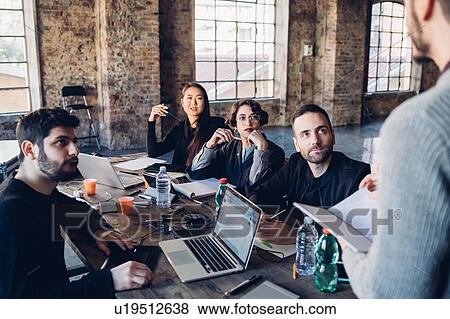 Designers having meeting in studio View Large Photo Image Stock Photo - Designers having meeting in studio. Fotosearch