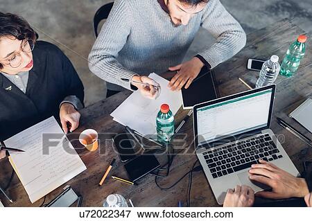 Designers having meeting in studio View Large Photo Image Stock Photo - Designers having meeting in studio. Fotosearch
