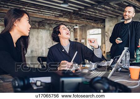 Designers having meeting in studio View Large Photo Image Stock Photograph - Designers having meeting in studio. Fotosearch
