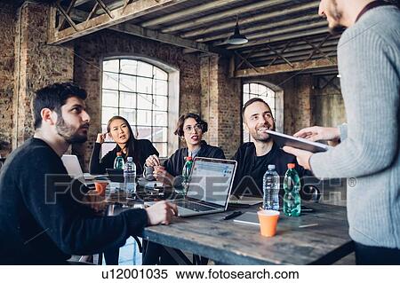 Designers having meeting in studio View Large Photo Image Stock Photography - Designers having meeting in studio. Fotosearch