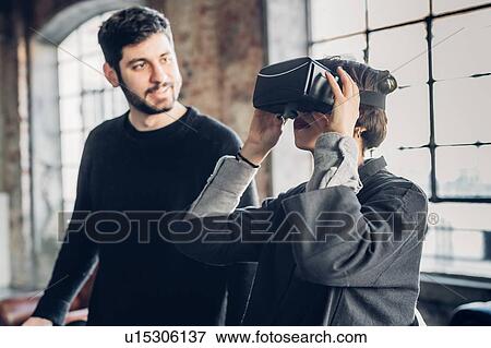 Designers testing virtual reality headset in studio View Large Photo Image Stock Photo - Designers testing virtual reality headset in studio. Fotosearch