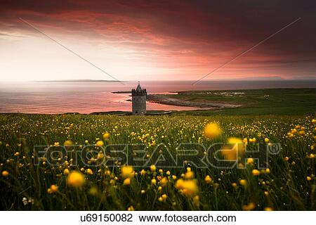 Stock Image - Doonagore Castle, Doolin Castle at sunset, Doolin, Clare, Ireland. Fotosearch