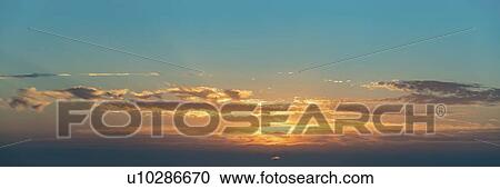 Stock Image - Dramatic sunset sky with clouds.. Fotosearch