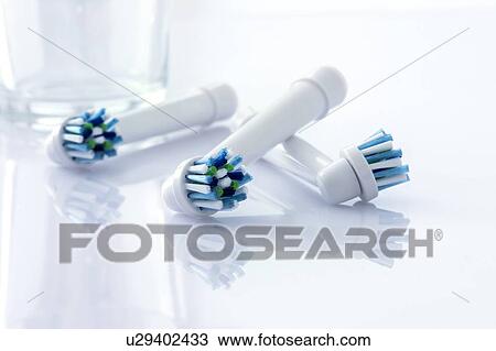 Electric toothbrush heads against a white background. View Large Photo Image Stock Image - Electric toothbrush heads against a white background.. Fotosearch