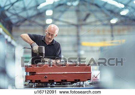 Engineer assembling gearbox in gearbox factory View Large Photo Image Stock Image - Engineer assembling gearbox in gearbox factory. Fotosearch
