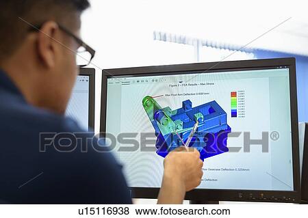 Engineer designing gearboxes using computer aided design (CAD) software in gearbox factory View Large Photo Image Stock Photo - Engineer designing gearboxes using computer aided design (CAD) software in gearbox factory. Fotosearch