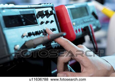 Engineer using electrical equipment (insulation tester) for measuring circuit. View Large Photo Image Stock Photo - Engineer using electrical equipment (insulation tester) for measuring circuit.. Fotosearch