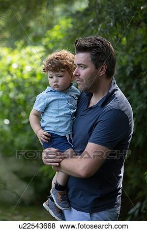 Stock Photo - Father and child in park. Fotosearch
