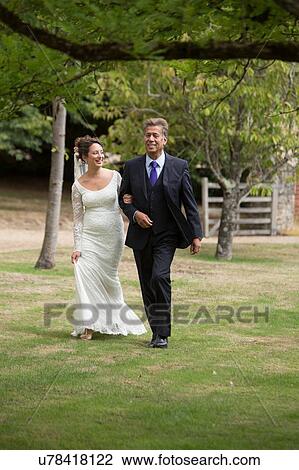 Father walking daughter to wedding View Large Photo Image Stock Image - Father walking daughter to wedding. Fotosearch