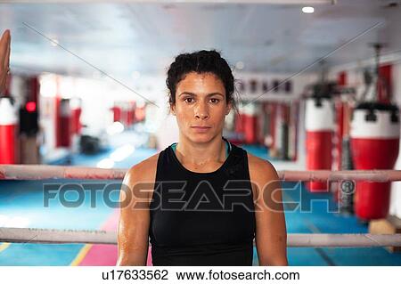 Stock Image - Female boxer in gym. Fotosearch