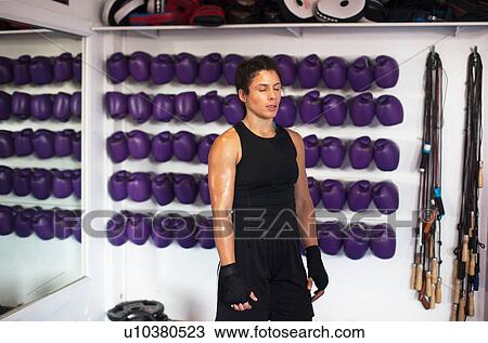 Female boxer resting in gym View Large Photo Image Stock Image - Female boxer resting in gym. Fotosearch