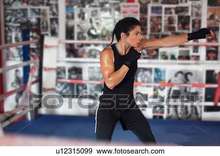 Female boxer training in gym View Large Photo Image Stock Photo - Female boxer training in gym. Fotosearch